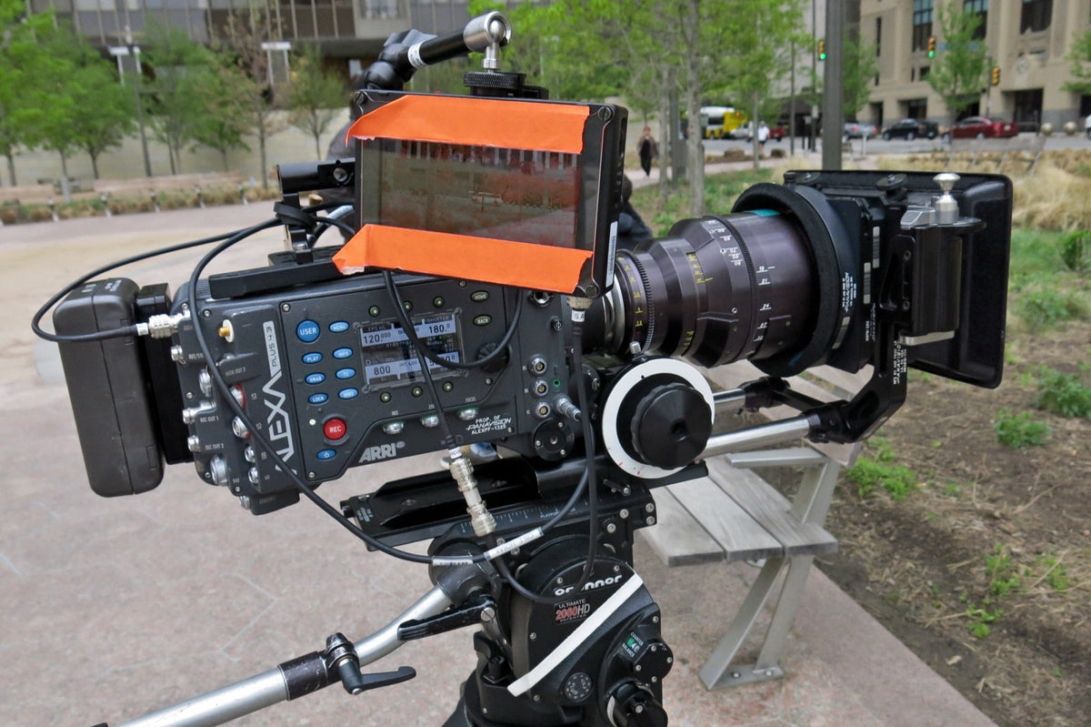 ARRI Alexa digital cinema camera mounted on a tripod outdoors.