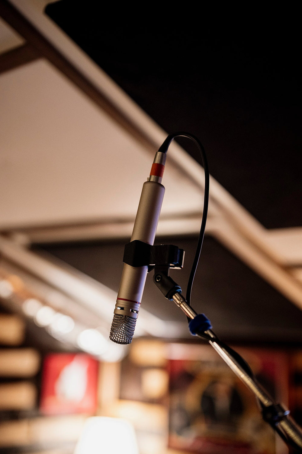 Close view of a microphone in a professional recording studio.